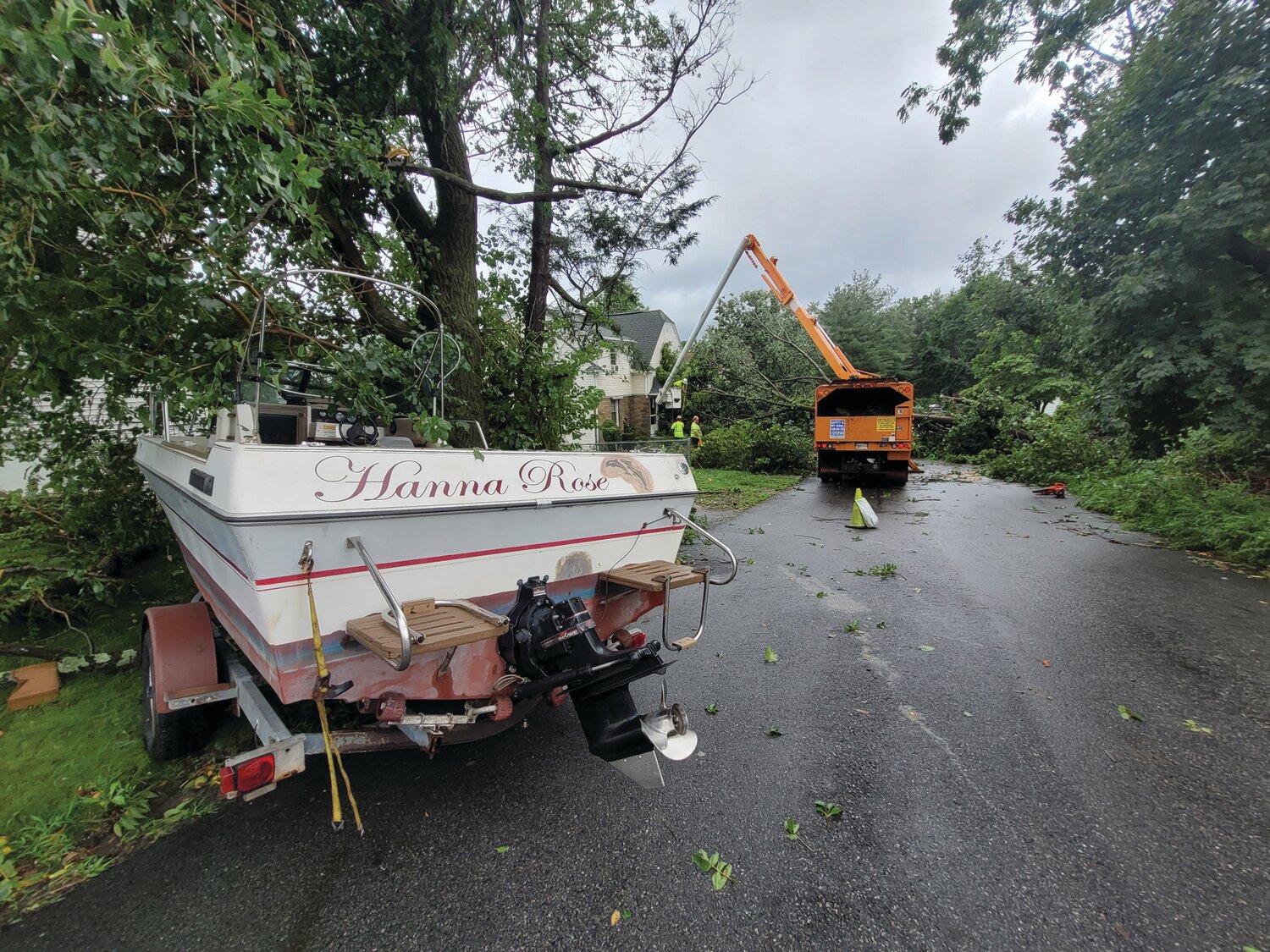 BOAT LOAD OF DAMAGE: This boat was tossed into the trees, and a few trees fell onto Amber Street houses. Residents were unable to exit via George Waterman for hours following the storm.